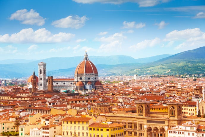 The iconic dome of Cathedral of Santa Maria del Fiore rising above the rooftops of Florence
