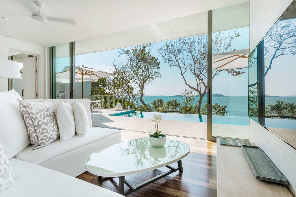 Luxurious COMO Point Yamu resort in Phuket, Thailand, overlooking turquoise Andaman Sea with sleek infinity pool and minimalist architectural design