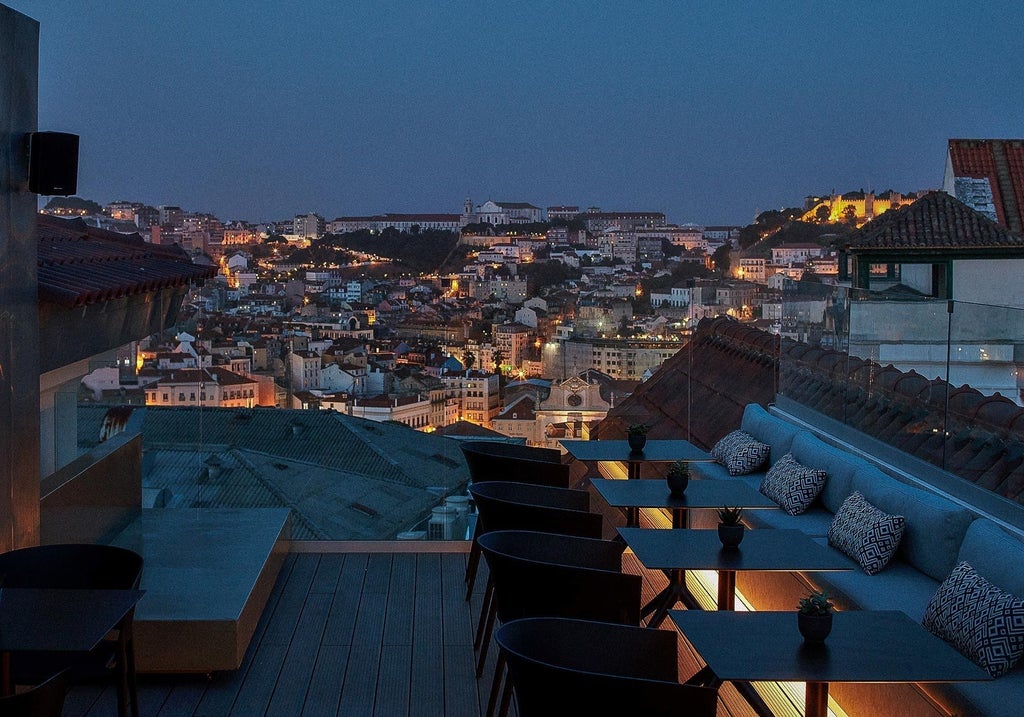 Luxurious boutique hotel in Lisbon with white-washed walls, elegant exterior, traditional architecture, and modern spa amenities nestled in historic district