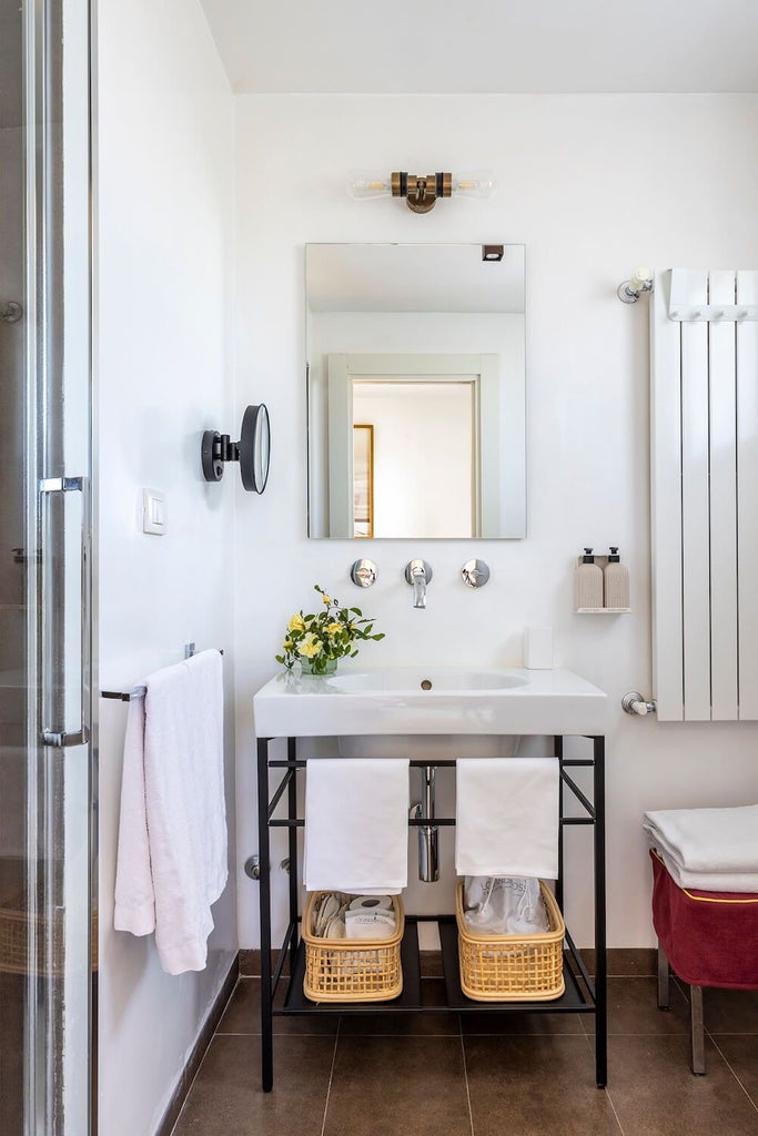 Elegant Prestige Garden Room at Locanda Rossa with plush white bedding, rustic wooden furniture, and soft natural light filtering through linen curtains