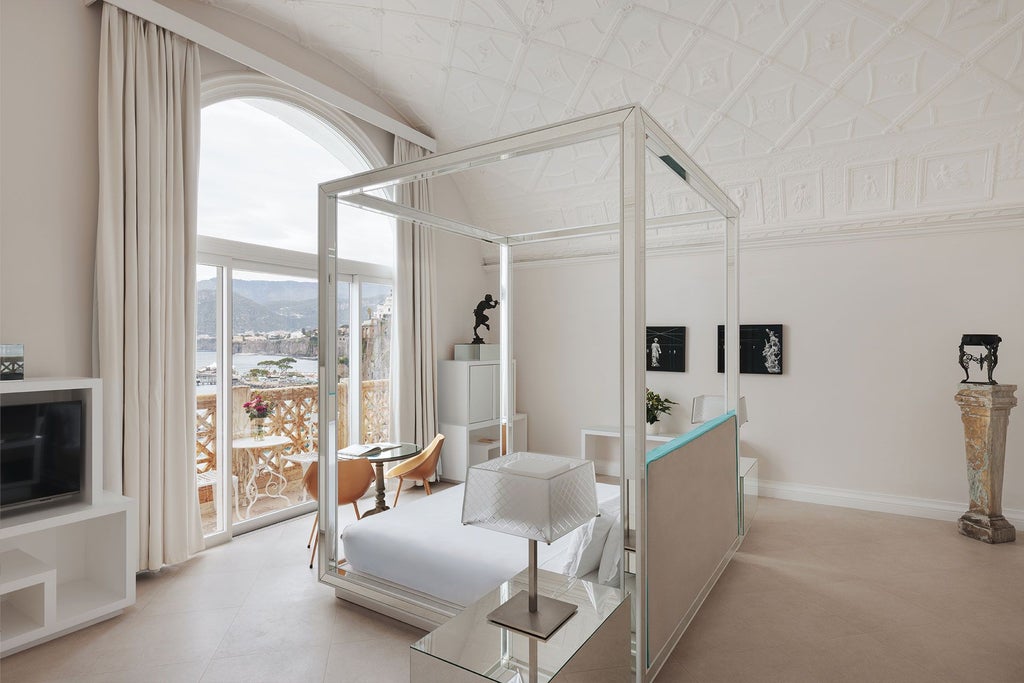 Opulent Italian coastal suite with panoramic Mediterranean view, elegant marble bathroom, plush white bedding, and sweeping blue sea vista from private balcony.