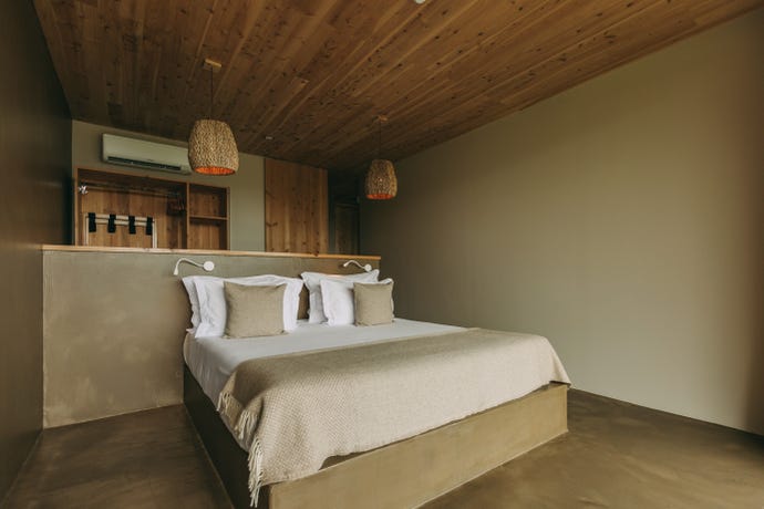 A bedroom overlooking the garden and ocean.
