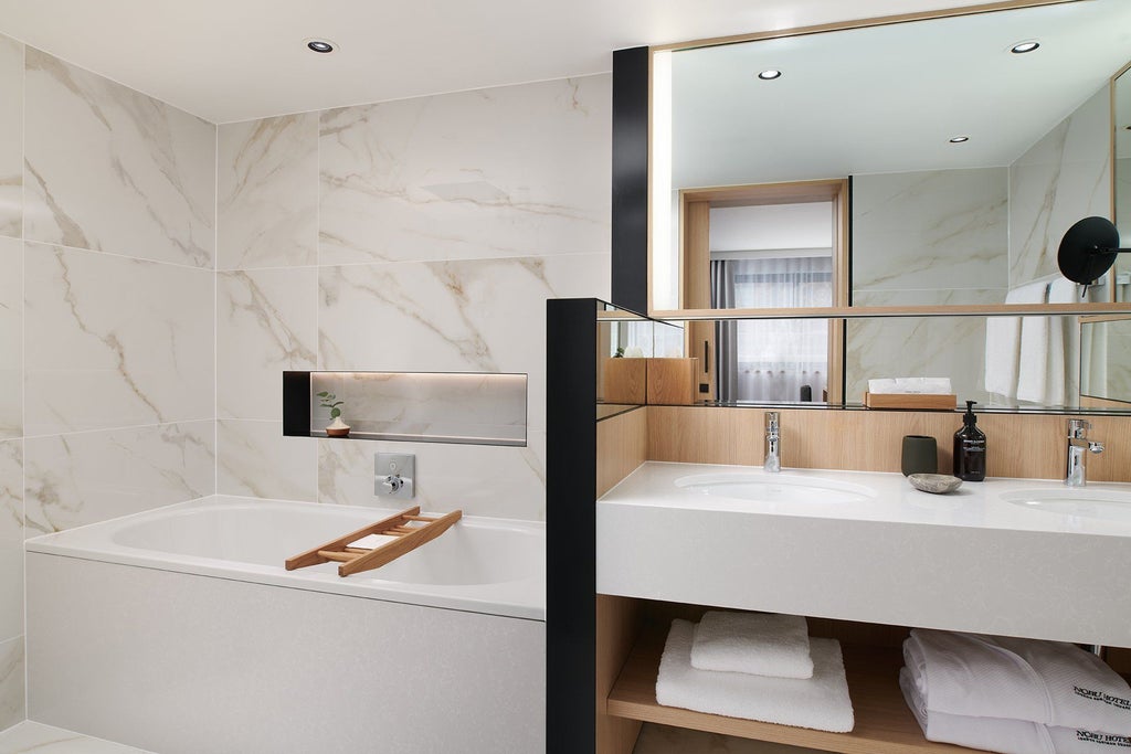 Minimalist zen suite with sleek contemporary design, featuring pure white linens, wooden accents, and panoramic city views in luxurious Nobu Hotel London Portman Square