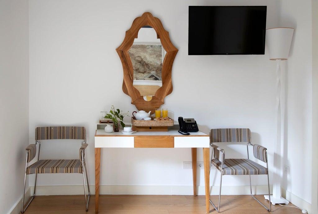 Elegant Prestige Garden Room at Locanda Rossa, featuring plush white linens, rustic terracotta floors, and soft natural light streaming through Italian-style windows