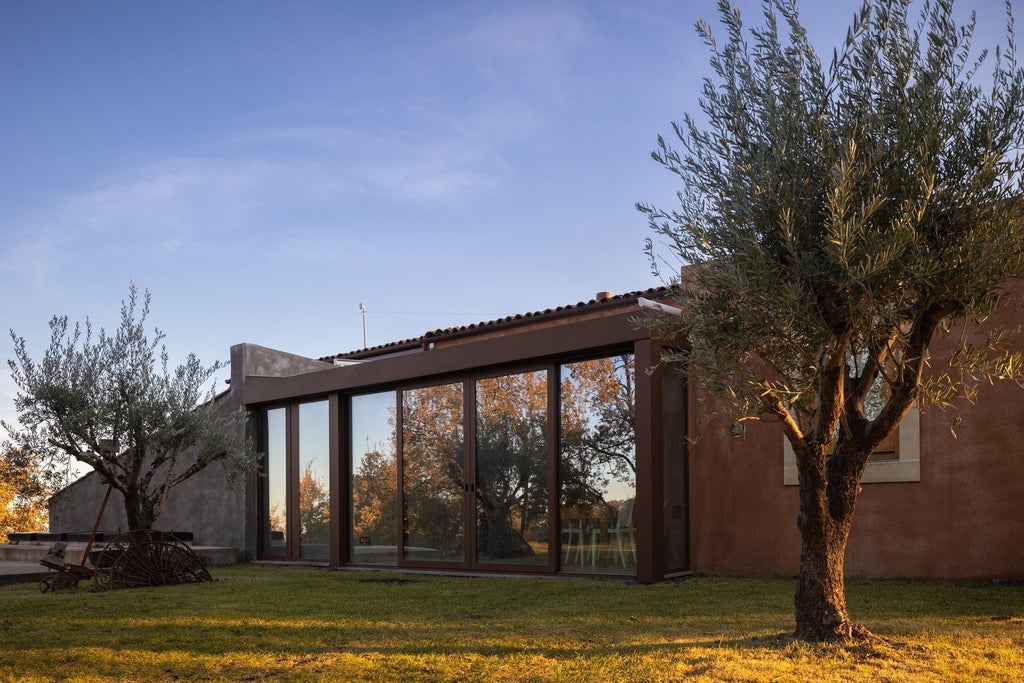 Elegant Sicilian luxury suite with panoramic mountain view, infinity pool overlooking lush vineyard landscape at scenic countryside retreat