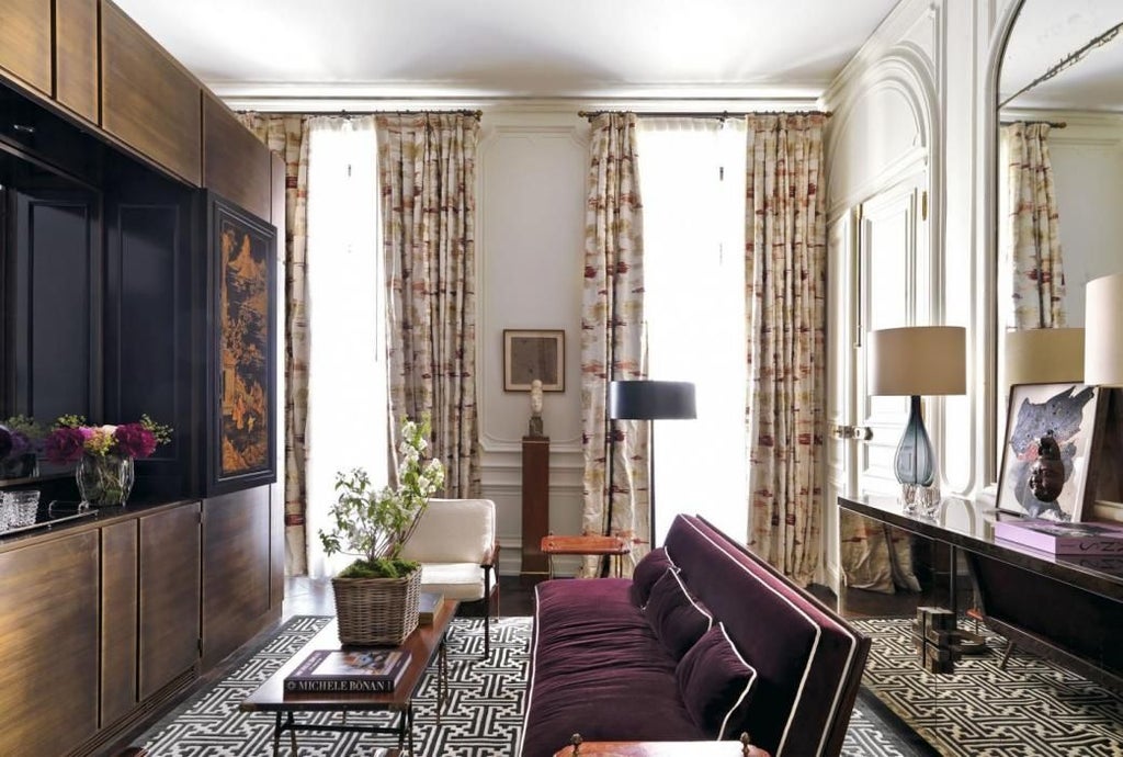 Luxurious master bedroom at J.K. Place Paris hotel, featuring elegant neutral tones, plush bedding, and sophisticated contemporary French design elements