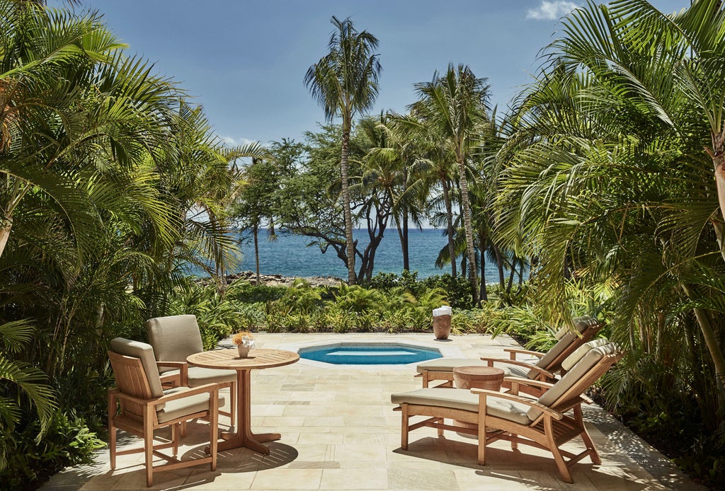 Resort nestled along Ko Olina coast with infinity pools, private cabanas and pacific ocean views, surrounded by tropical landscaping