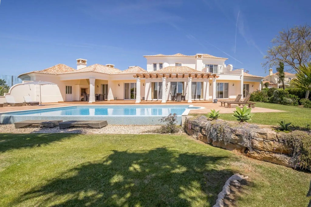 Spacious luxury villa at Martinhal Sagres Beach Resort, featuring modern design, large windows, and panoramic views of coastal Portuguese landscape.