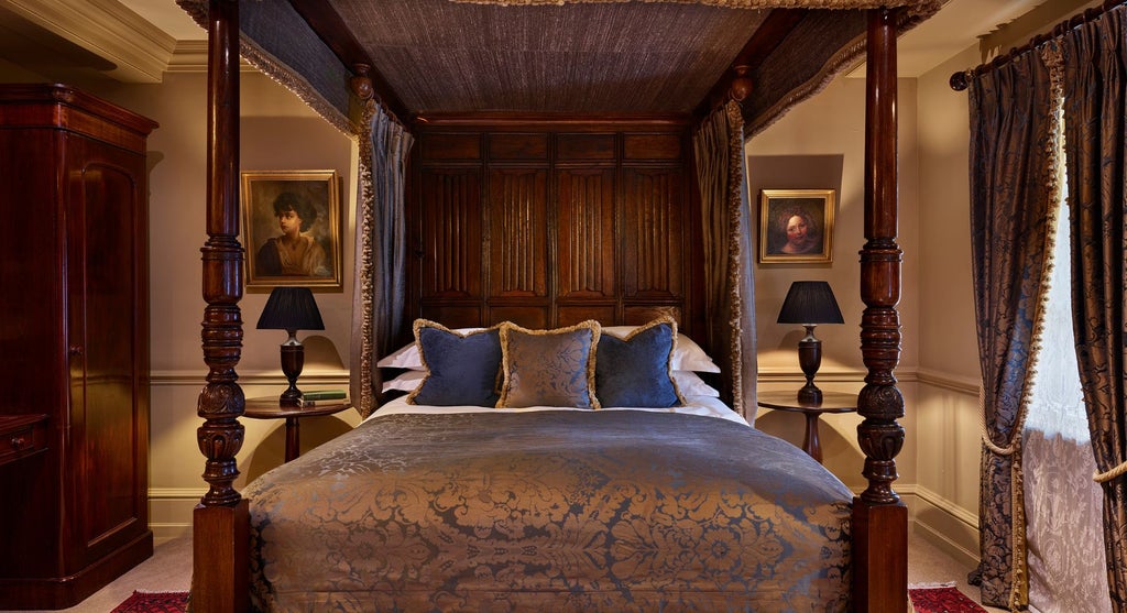 Luxurious deluxe double hotel room at Batty Langley's, featuring elegant vintage decor, plush bedding, and soft ambient lighting in a sophisticated UK setting.