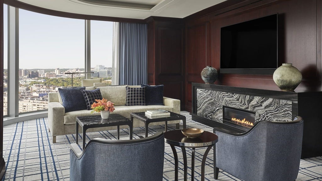 Spacious Presidential Suite at scenset Four Seasons Hotel, featuring panoramic city views, elegant modern decor, and luxurious king-sized bed with plush linens and sophisticated design