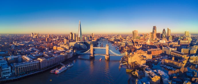 The skyline of London centered around the iconic Tower Bridge
