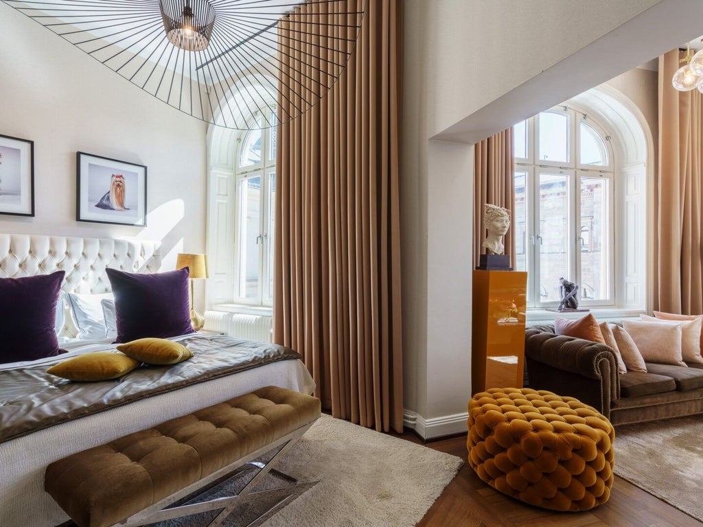 Elegant medium king hotel room at Lydmar Hotel with plush bedding, muted color palette, modern Swedish design, and soft ambient lighting