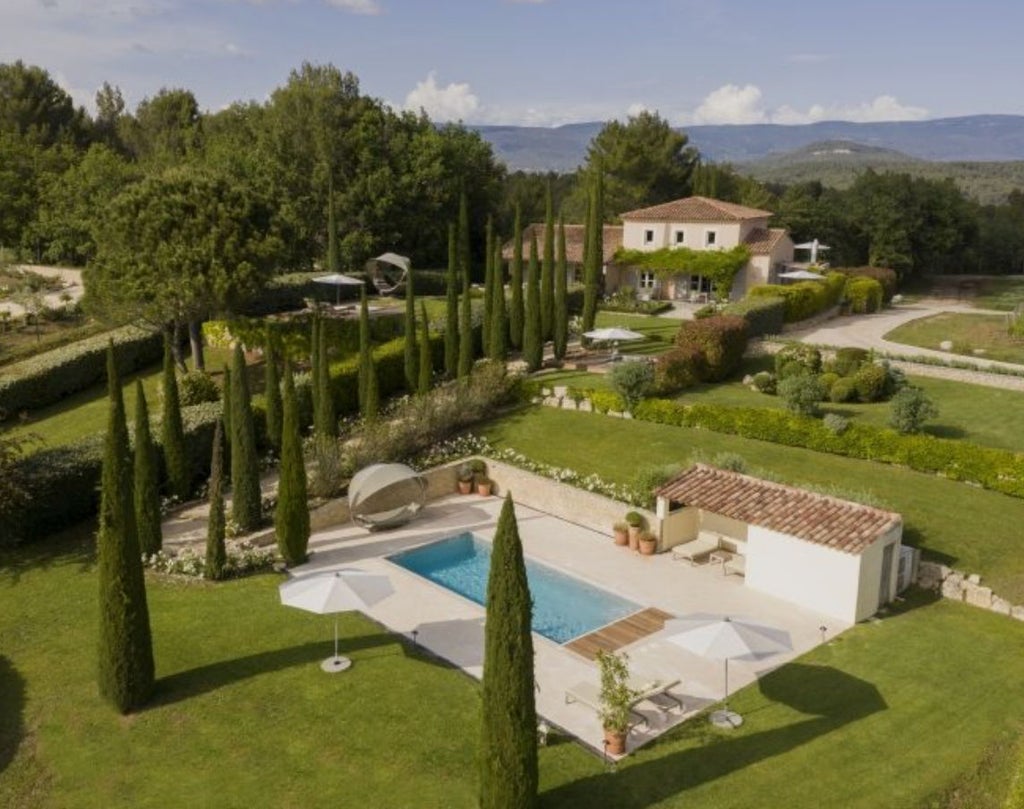 Modern luxury pool suite features private terrace with infinity plunge pool overlooking Provence vineyards and Luberon mountains