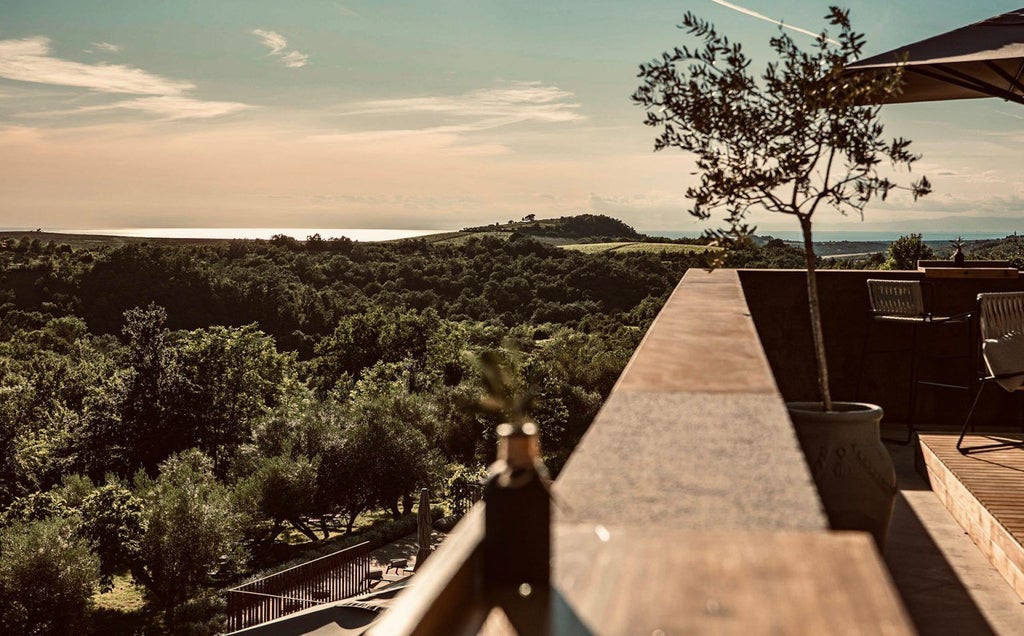 Elegant white stone boutique hotel with ornate balconies and Mediterranean architecture nestled among lush gardens in coastal Croatia