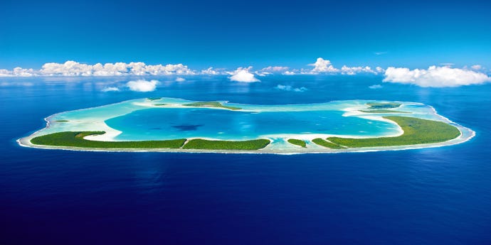 The atoll surrounds a bright blue lagoon