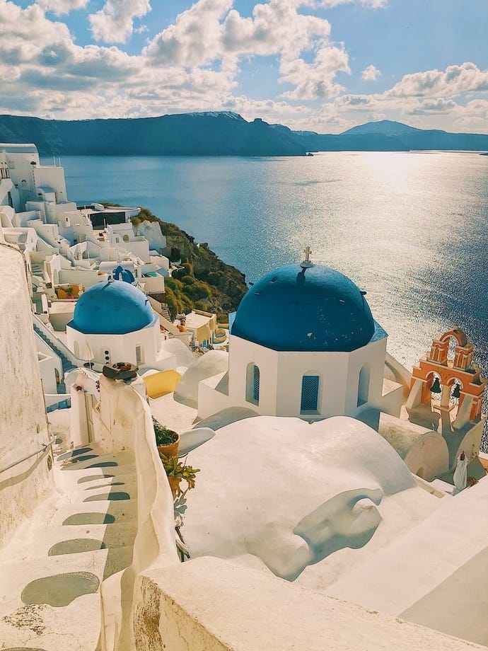 Find yourself among the iconic whitewashed buildings and Santorini blue roofs as you look out onto the magnificent caldera
