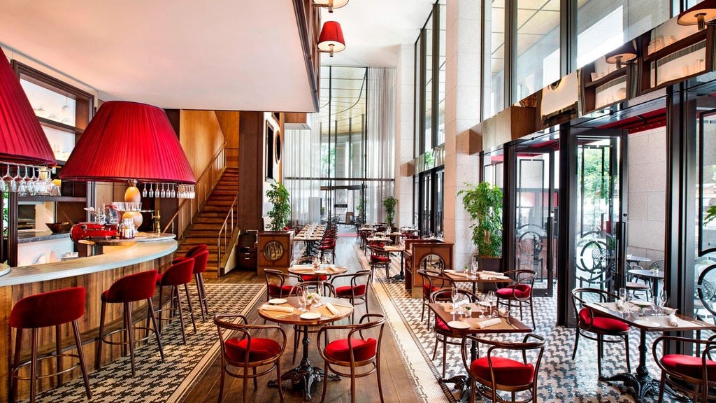 Luxurious lobby of high-end hotel in Osaka, featuring elegant marble floors, modern chandeliers, and sleek contemporary design with traditional Japanese aesthetic accents