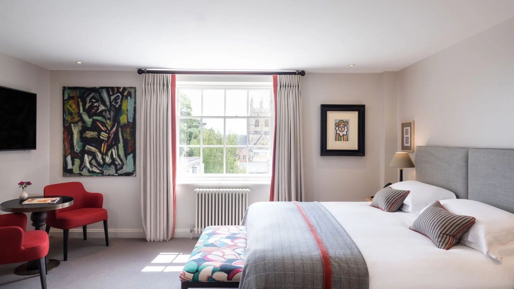 Elegant heritage room with vintage wooden furnishings, plush white linens, and refined architectural details from classic United Kingdom hotel interior