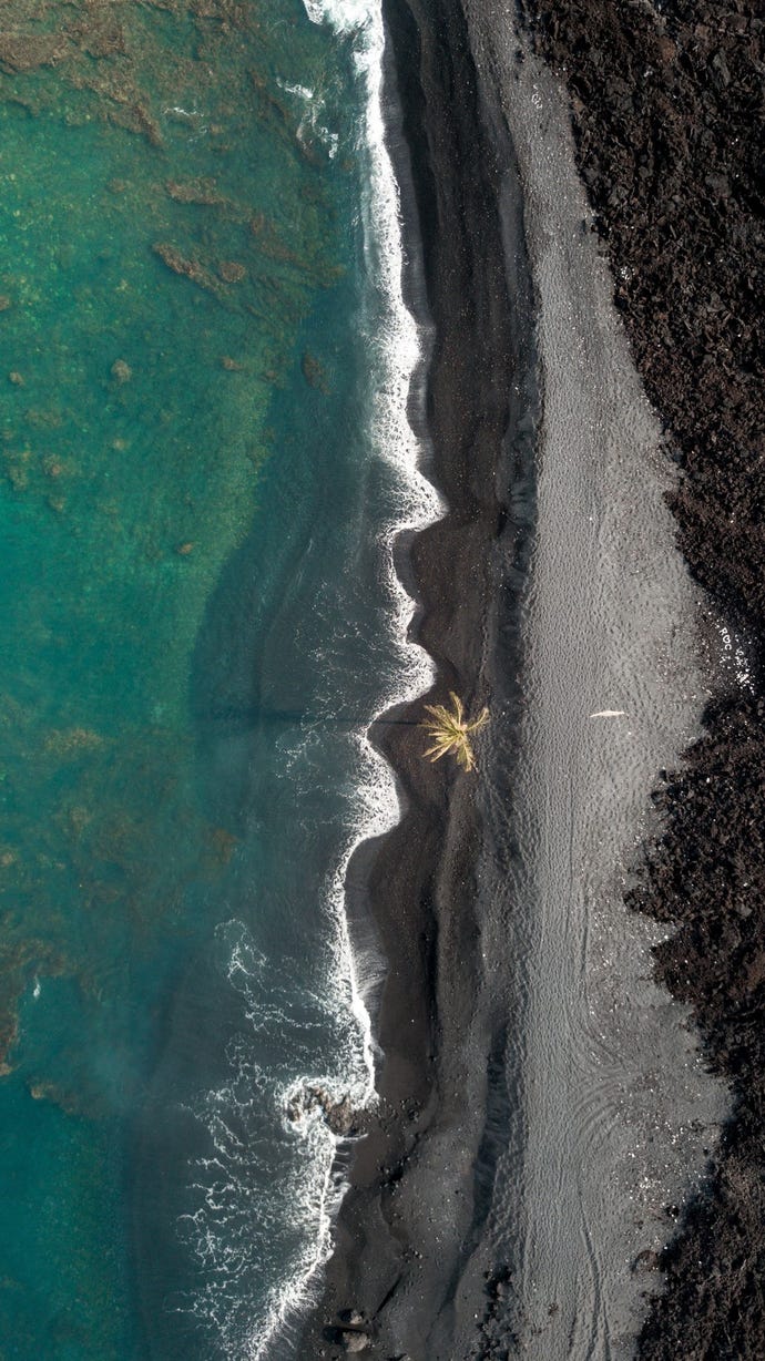 Home to Volcanoes National Park, the Big Island of Hawaii features beaches of black sand derived from sediment of volcanic rock found all over the island.