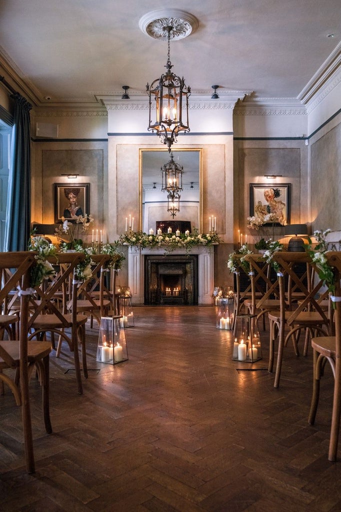 Elegant Georgian townhouse hotel with soft cream facade, large sash windows, and classic architectural details in Cheltenham's historic city center