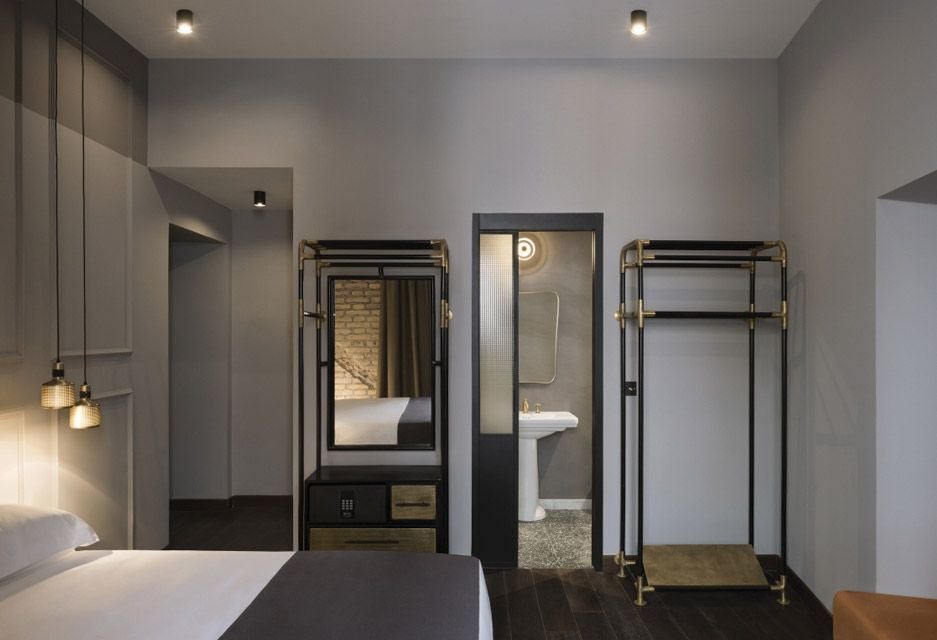 Elegant baby double hotel room at Chapter Roma, featuring minimalist design, soft neutral tones, plush bedding, and contemporary Italian interior styling