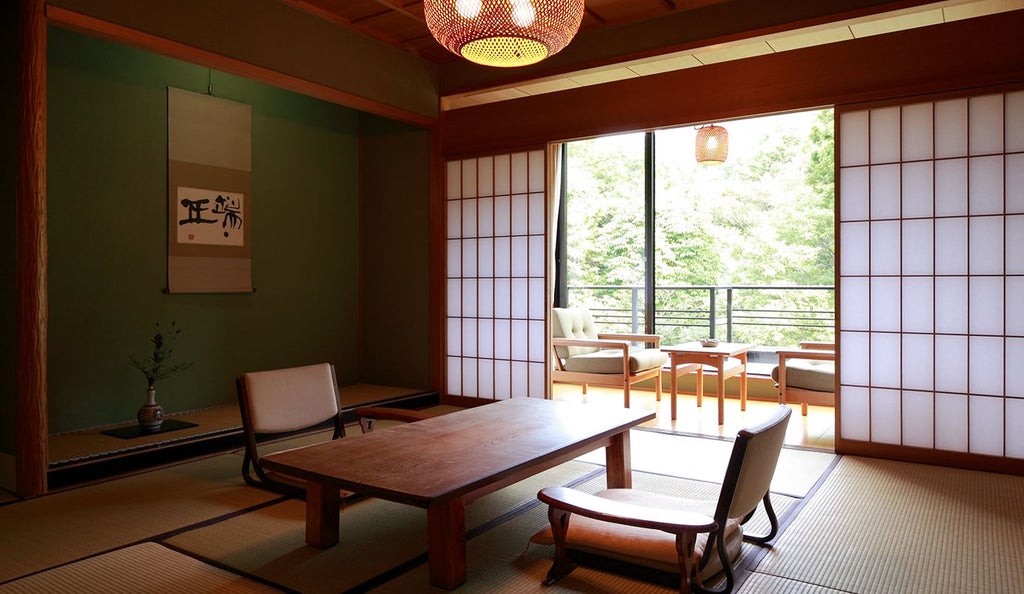 Luxurious Japanese-style family suite with tatami flooring, traditional sliding doors, elegant wooden furnishings, and soft natural lighting in Higashiyama, Kyoto