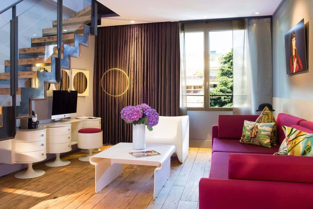 Elegant French garden duplex suite with botanical decor, plush white bedding, and soft natural lighting in a sophisticated Parisian boutique hotel room.