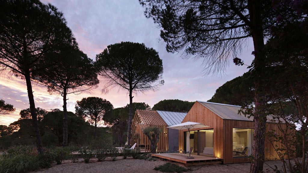 Luxurious white minimalist coastal retreat with clean lines, swimming pool, and natural wood accents overlooking the serene landscape of scenset, Portugal