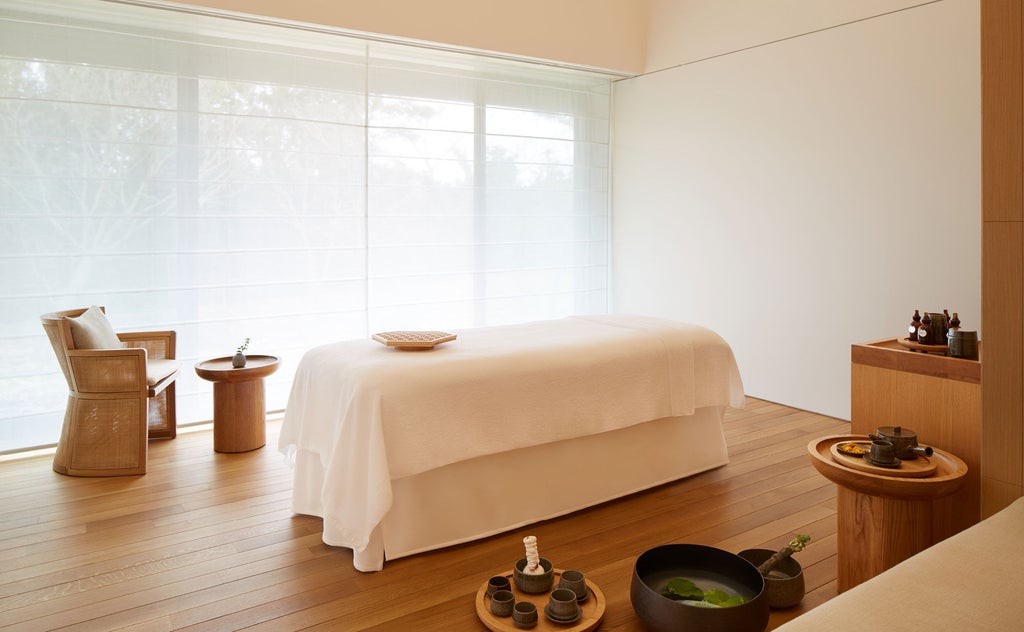 Modern Japanese luxury villa with private onsen bath overlooking Ago Bay, featuring minimalist architecture and natural stone details