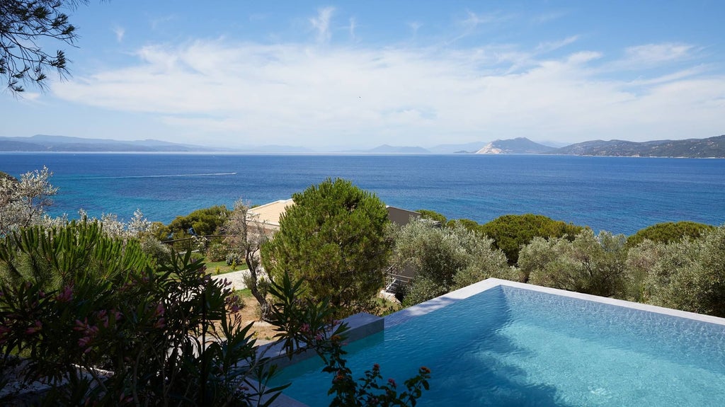 Luxurious junior suite with private pool overlooking azure Aegean waters, featuring modern minimalist design and seamless indoor-outdoor living at ELIVI Skiathos