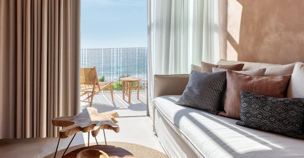 Elegant Sapphire Junior Suite with sweeping views of azure Aegean waters, white-washed walls, and luxurious contemporary Mediterranean design in Corfu, Greece