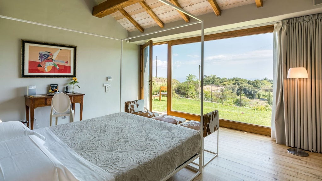 Luxurious five-bedroom villa nestled in Sicilian countryside, featuring rustic stone walls, elegant furnishings, and panoramic views of Mount Etna landscape