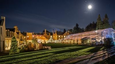 Opulent five-star luxury hotel nestled in scenic Yorkshire countryside, featuring grand neoclassical architecture with manicured gardens and elegant stone facade