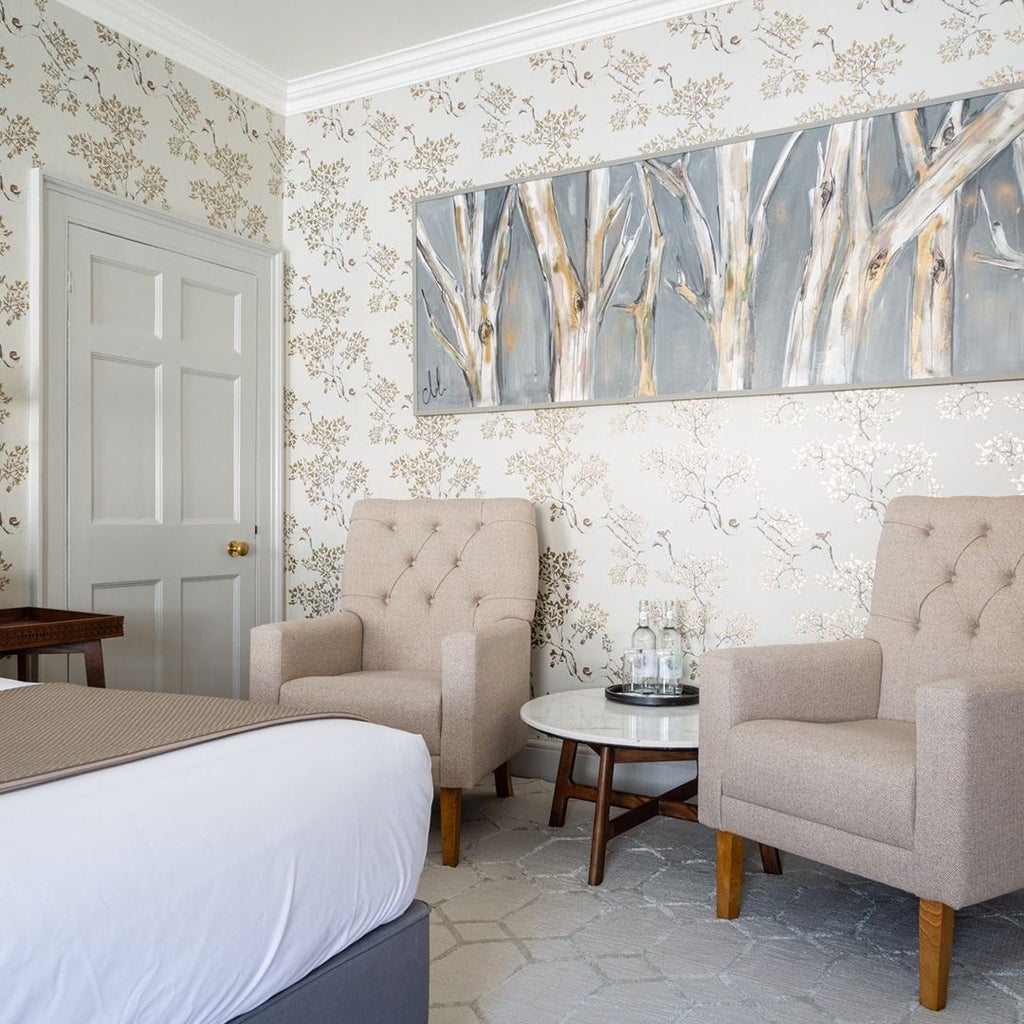 Elegant master deluxe hotel room with plush king bed, soft neutral tones, contemporary decor, and luxurious textiles at The Queensberry in United Kingdom