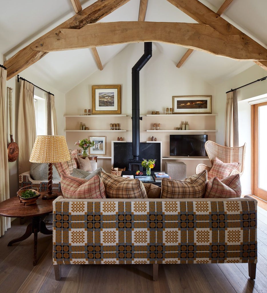 Elegant hotel room at Grove of Narberth with soft cream walls, plush bedding, antique furniture, and subtle countryside charm in muted tones