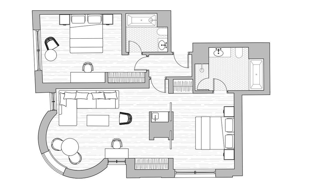 Luxurious two-bedroom suite with modern design, plush king beds, elegant living area, and sophisticated neutral color palette at a prestigious UK hotel.