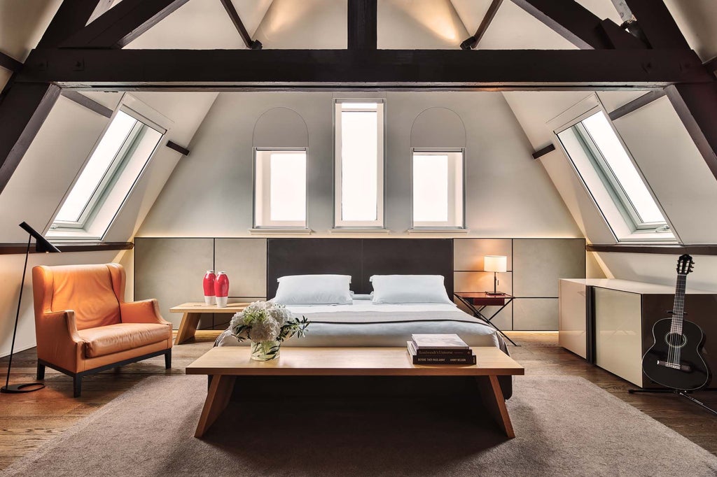 Luxurious I Love Amsterdam Suite at Conservatorium Hotel, featuring modern design, plush furnishings, and panoramic city views in a sophisticated Amsterdam setting