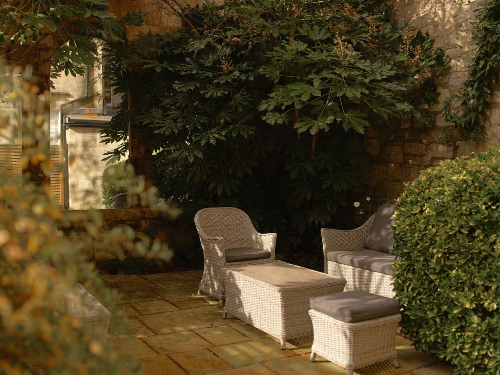 Elegant Georgian townhouse hotel in Bath, UK, featuring refined facade, soft warm lighting, and classic architectural details reflecting timeless British hospitality