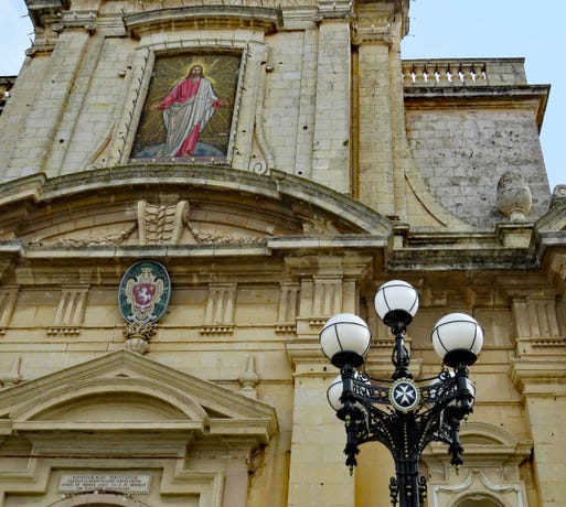 The Maltese Cross on a lamp post in front of the Basilica of St. Paul, Rabat