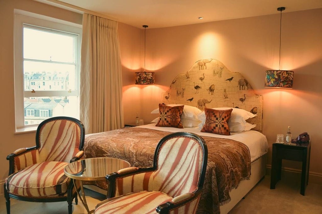 Luxurious Abbey King hotel room with elegant decor, plush bedding, soft neutral tones, and sophisticated lighting creating a serene, high-end hospitality ambiance.