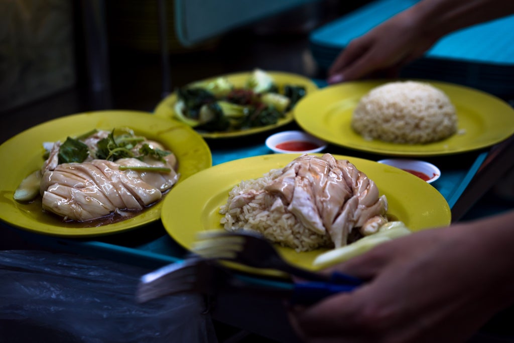 Vibrant Chinatown hawker center bustling with local culinary artisans, colorful food stalls, diverse dishes, and UNESCO heritage street food culture in Singapore