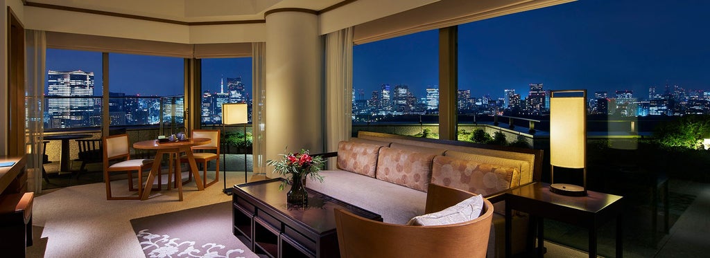 Elegant Chiyoda Suite at Palace Hotel Tokyo, featuring panoramic city views, contemporary design, and luxurious minimalist decor with expansive windows and neutral color palette