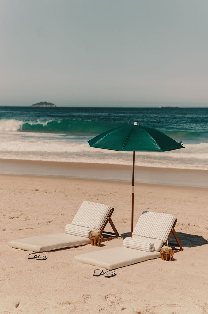 Luxurious beachfront hotel with art deco architecture, overlooking Ipanema Beach, featuring elegant white facade and stunning panoramic views of Rio's coastline