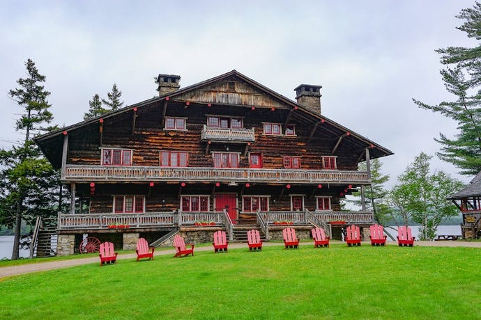 Typical Adirondack chairs in front of the Main Lodge at the Great Camp Sagamore, built in 1897