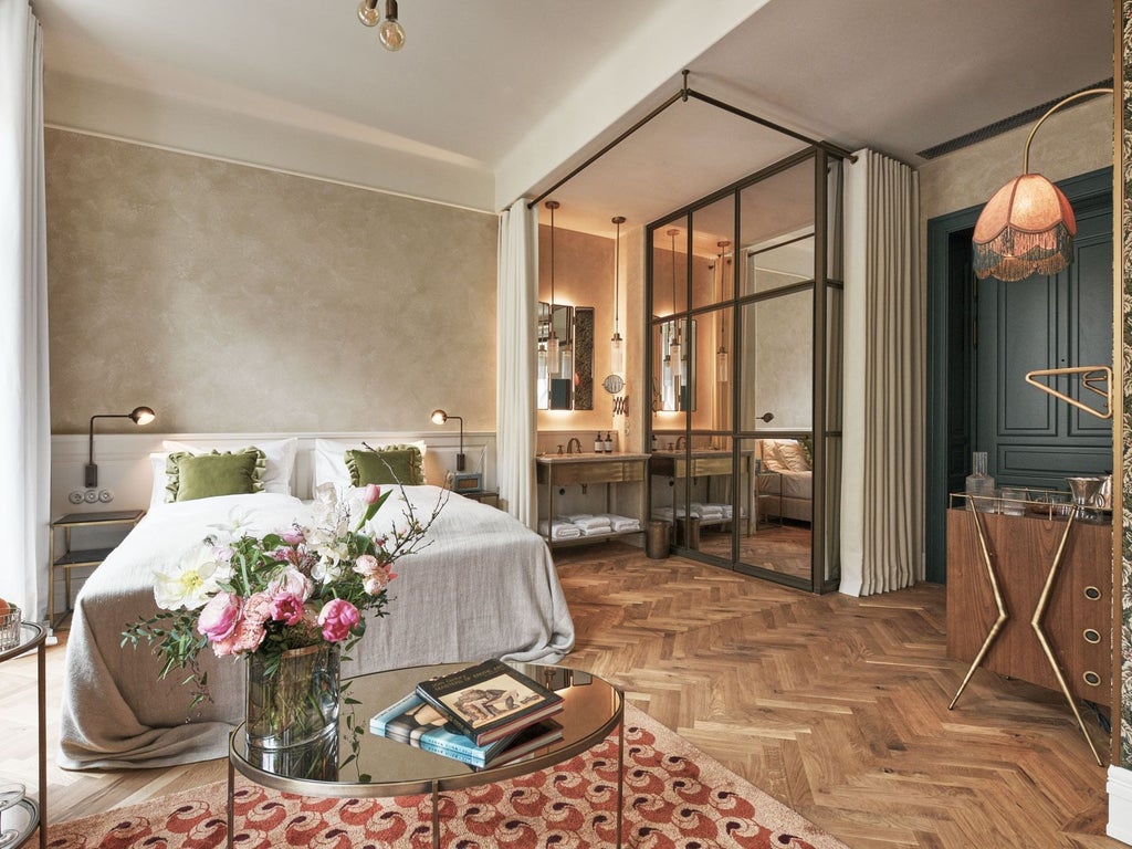 Minimalist Austrian hotel room with wooden furnishings, crisp white linens, soft ambient lighting, and sleek modern design featuring mountain view through large window