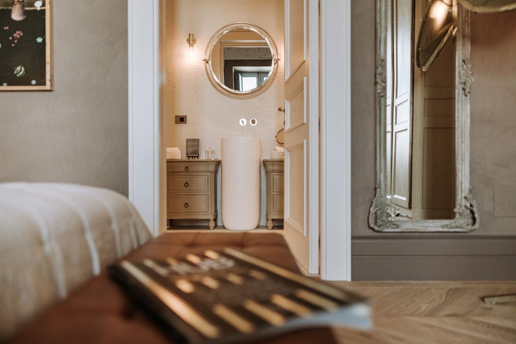 Elegant boutique hotel room with plush white bedding, ornate marble bathroom, and soft natural light streaming through large windows in [Location] Italy