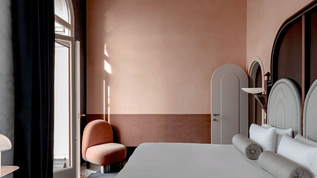 Luxurious executive hotel room overlooking Venice canal, featuring elegant balcony, sophisticated Italian design, and panoramic waterfront views of Giudecca