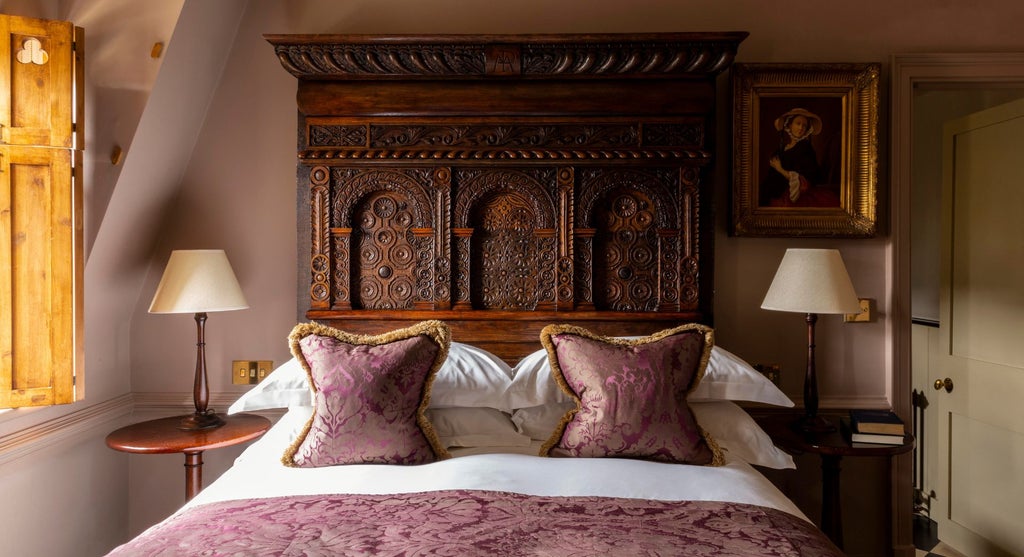 Luxurious club double room at Batty Langley's, featuring elegant dark walls, plush bedding, and sophisticated antique-inspired decor in a refined setting