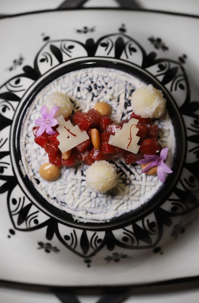 beef tartare with fried polenta, pine nuts, and saffron