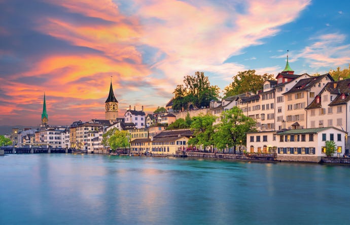 The historic Fraumunster and Grossmunster Churches overlooking River Limmat on Lake Zürich
